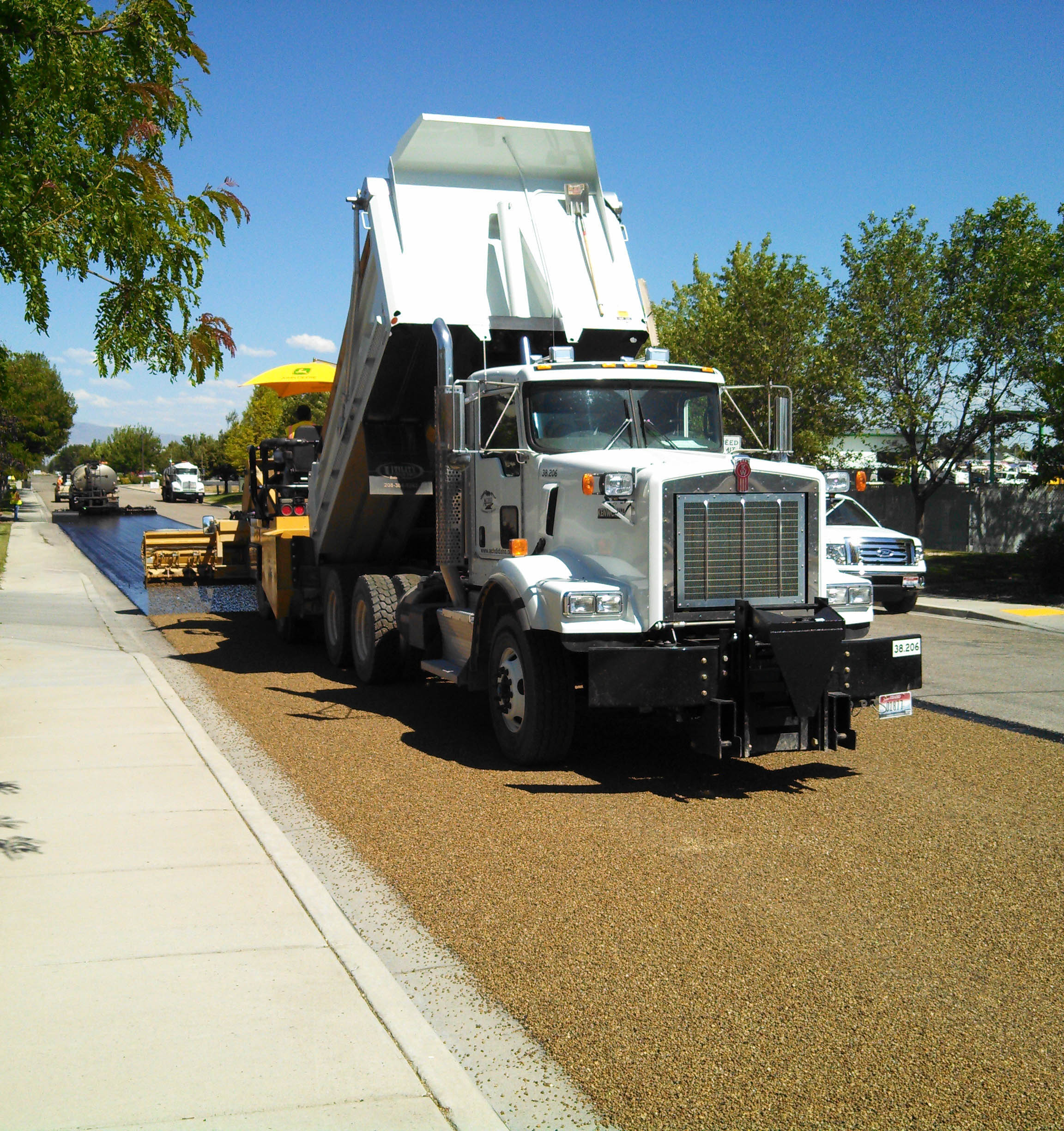 Photograph of chip sealing roadway