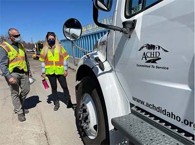 Photograph of Commissioner Pickering and Tom Mercer at sweeper truck